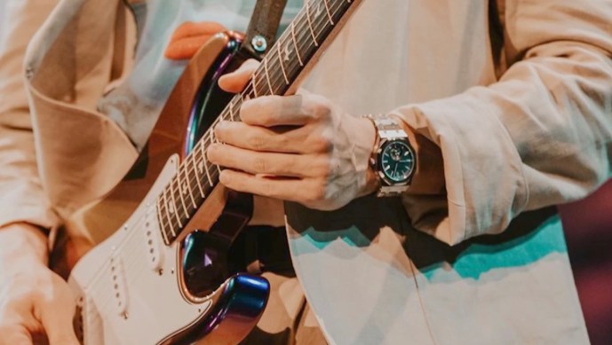 Screengrab of John Mayer on stage with Audemars Piguet Royal Oak tourbillon